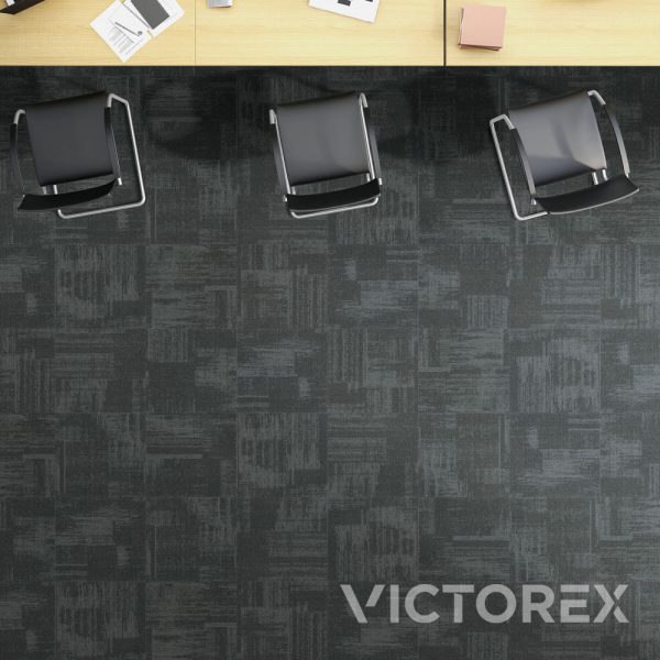 Victorex Abstract carpet tiles Grease colour in a room with desks and chairs viewed from the top