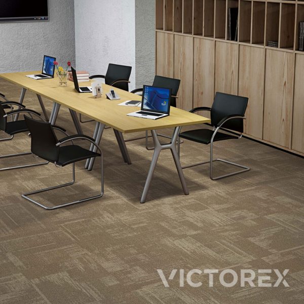 Victorex Abstract carpet tiles Greige colour in meeting room with chairs, table and laptops.