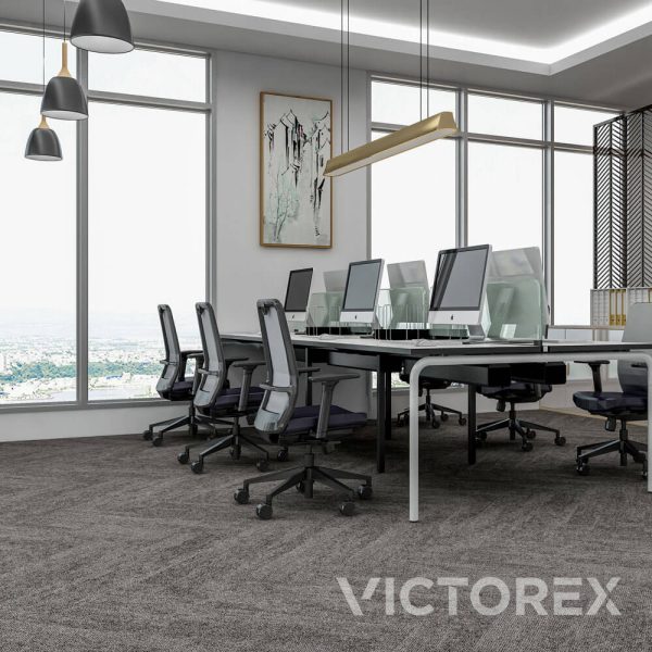 Victorex Gravity carpet tiles Basalt colour in an office with computers