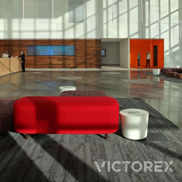 Interface Human Nature HN850 plank carpet tiles in Slate colour in an open foyer.