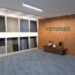 Victorex about us front desk office with design samples of carpet tiles