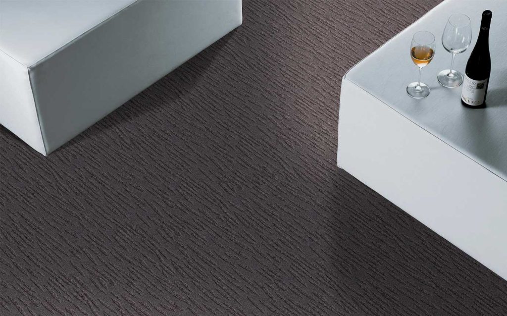 Victorex Broadloom Carpet combining carpet colours with two white sofas and wine glass arranged horizontally Victorex Broadloom Carpet combining carpet colours with two white sofas and wine glass arranged horizontally