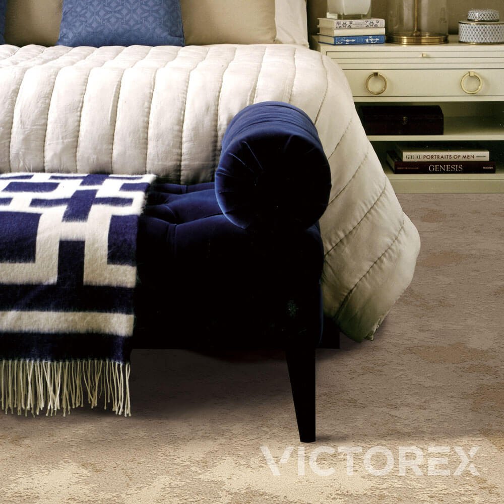 Victorex Geoscape broadloom carpet in Golden Beach colour in a bedroom with blue sofa Victorex Geoscape broadloom carpet in Golden Beach colour in a bedroom with blue sofa