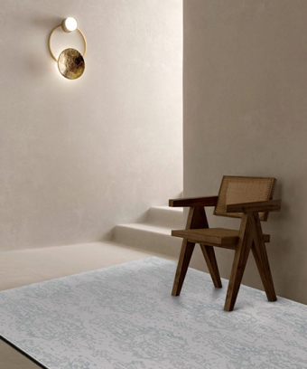 Victorex Luca Rugs on wooden bench in living room beside stairs with wall golden ring light. Victorex Luca Rugs on wooden bench in living room beside stairs with wall golden ring light.